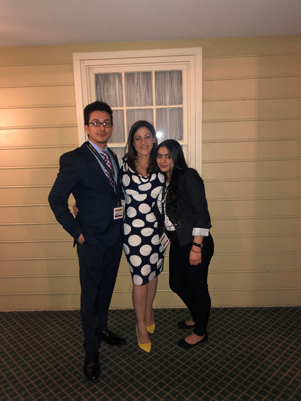 District Director Judy Goris-Moroff is flanked by Erlyn Flores Reyes and Yolani Cabrera.