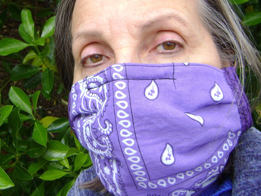 Teacher Kim Valerio models the face mask she created.