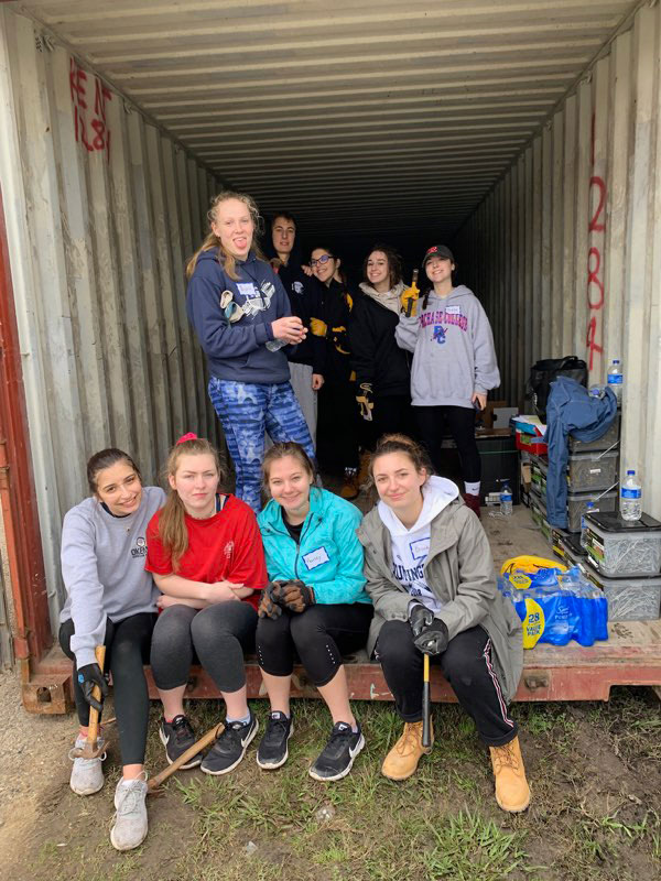 Brooke Biernacki (right) on a work site with fellow Habitat for Humanity members.