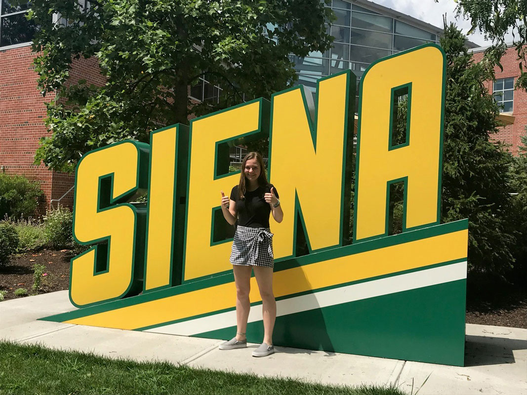 Karley Mathews gives a thumbs up at Siena College.