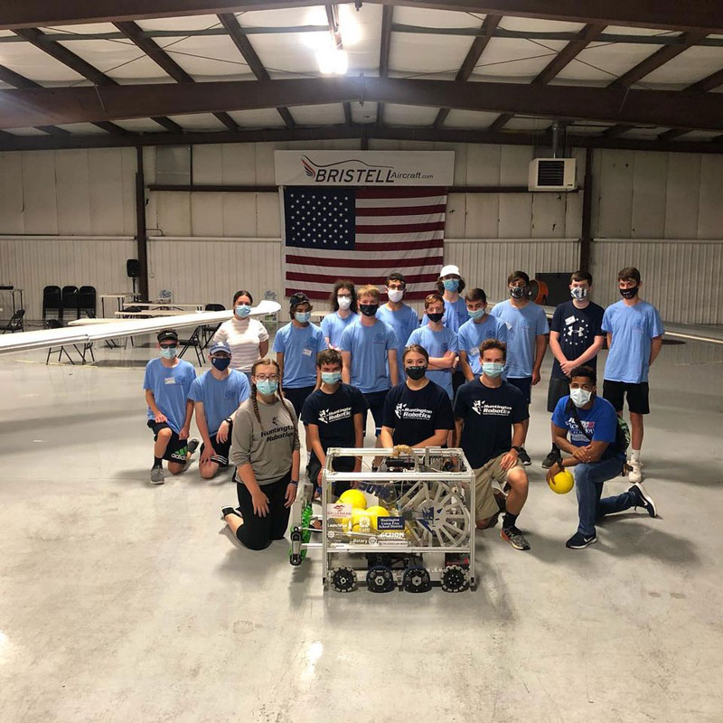 Huntington Robotics team members (front) with participants in the Mid Island Air Service summer camp at LI MacArthur Airport.