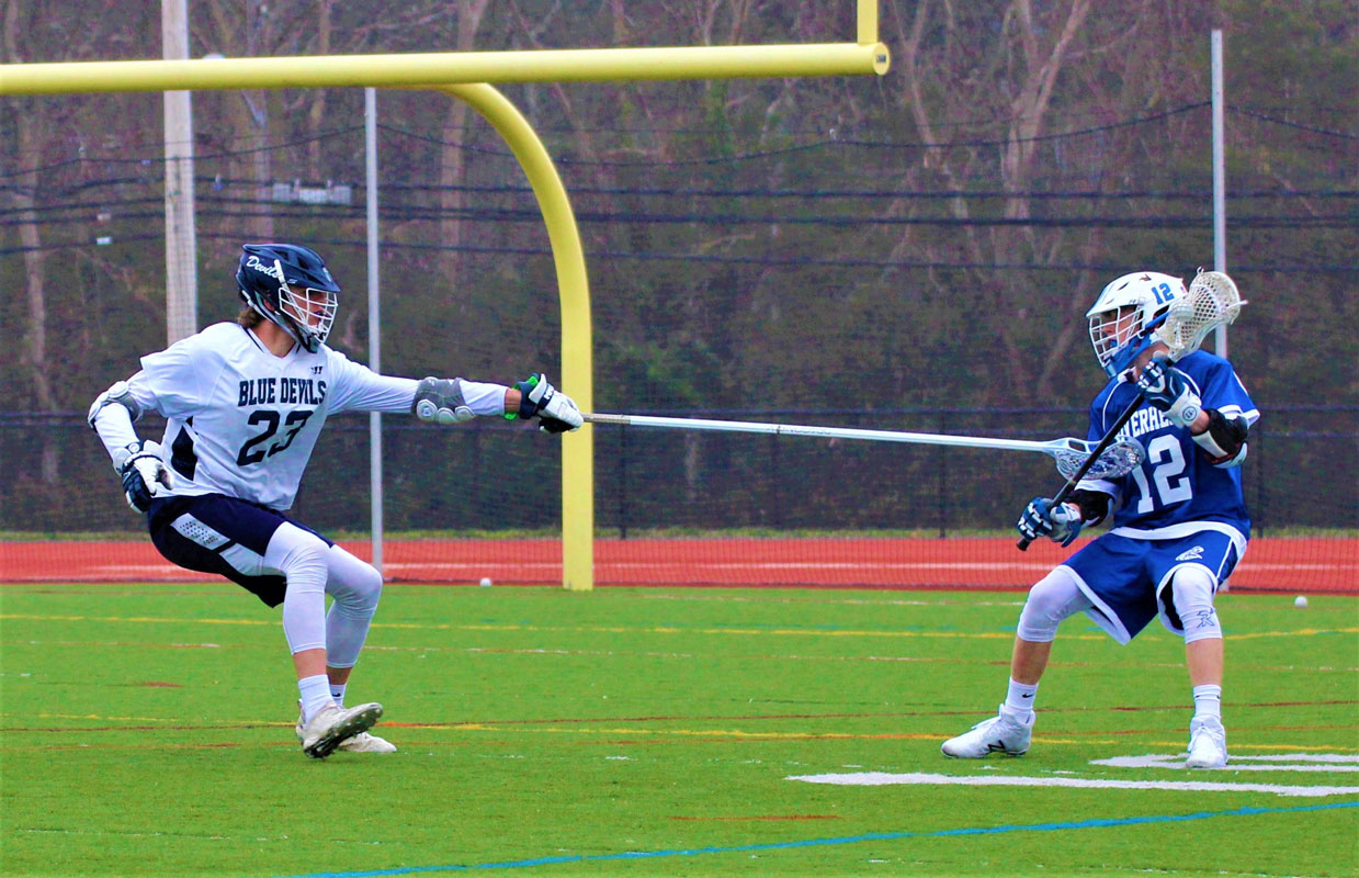 Trevan Meagher (left) plays defense for Huntington. (Erik Krisch photo.)