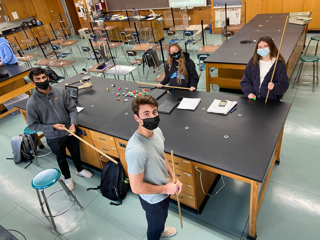 Huntington High School AP Physics students engage in a lab on Hooke's Law.