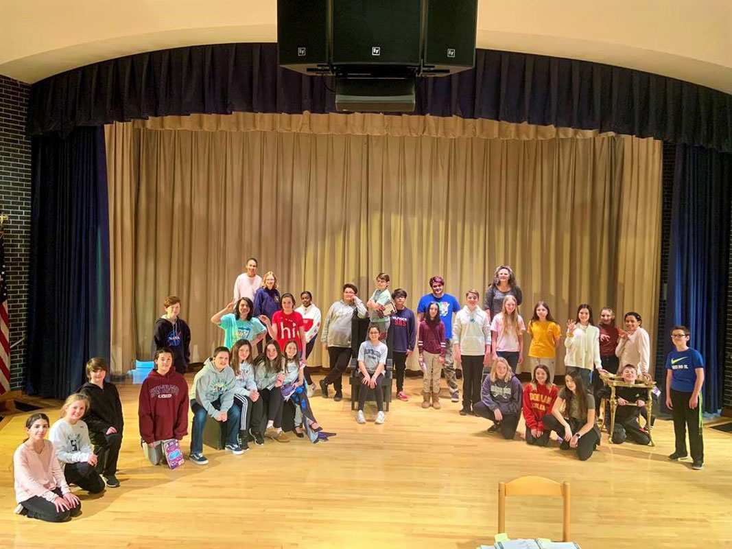 The cast of Alice in Wonderland Jr. is ready for a great show.