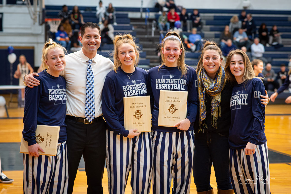 Blue Devil coaches Mike Kaplan and Marissa Bergmann with the seniors. (Darin Reed photo.)