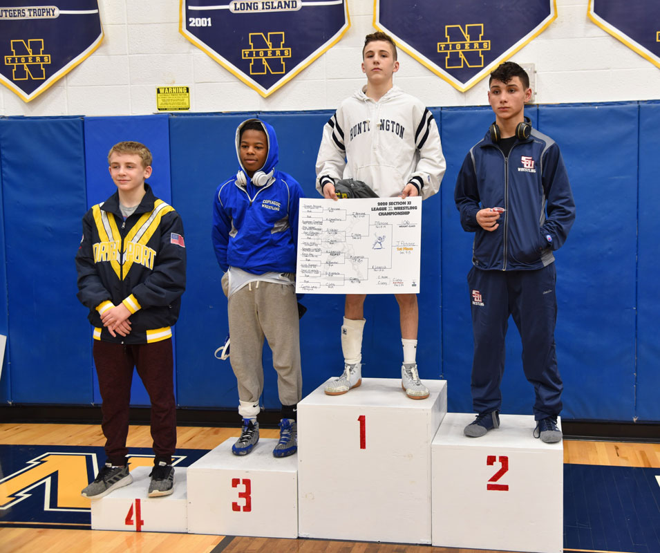Junior Joe Petrone on the Suffolk League III title at 106 lbs.