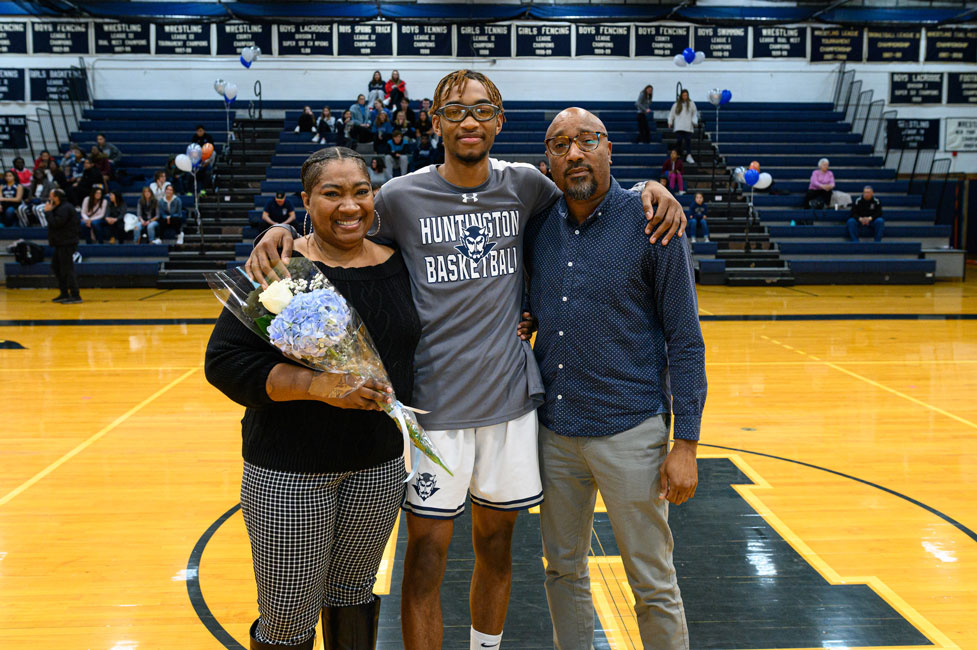 Omari Stephen with his parents, Tanya and Duane on Blue Devil basketball Senior Night. (Darin Reed photo.)