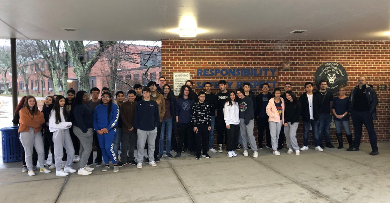 Huntington High School students wait for the bus to take them to the Yaphank correctional facility.