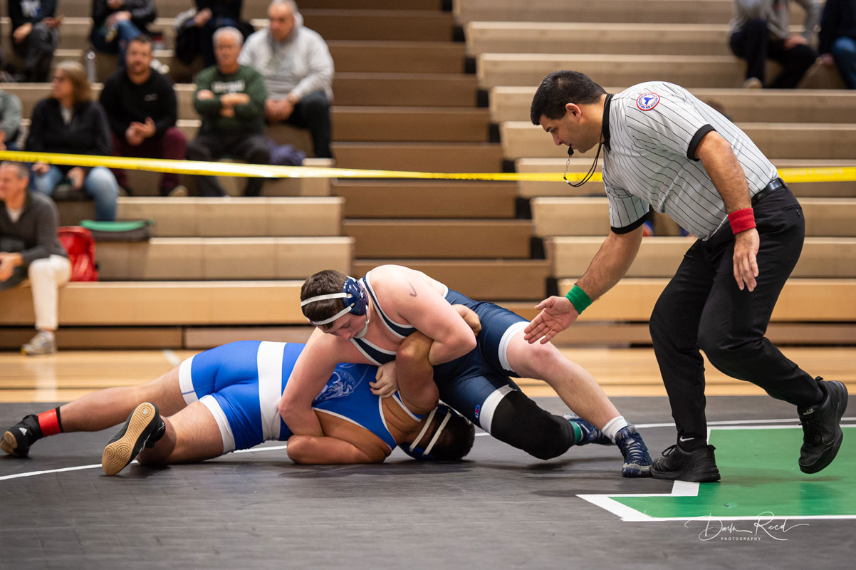 Robbie Smith (top) runs a bar arm on an opponent this winter. (Darin Reed photo.)