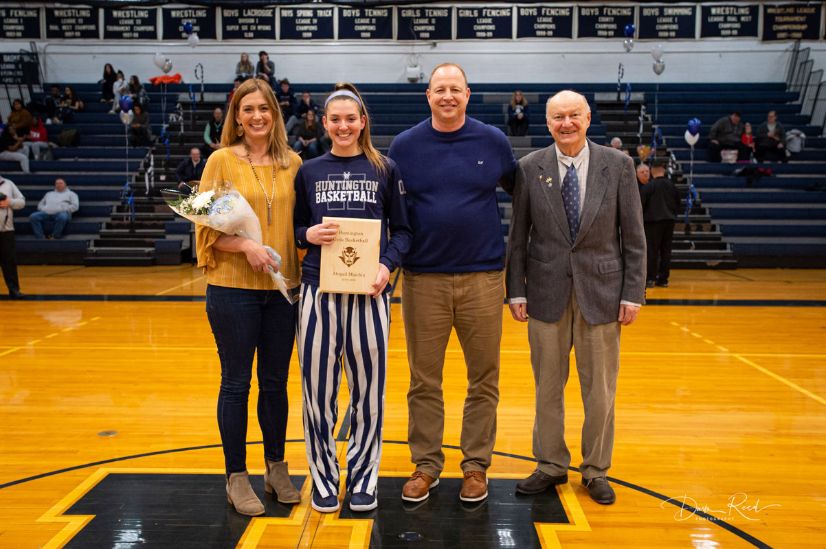 Abby Maichin with her parents and grandfather on Senior Night. (Darin Reed photo.)