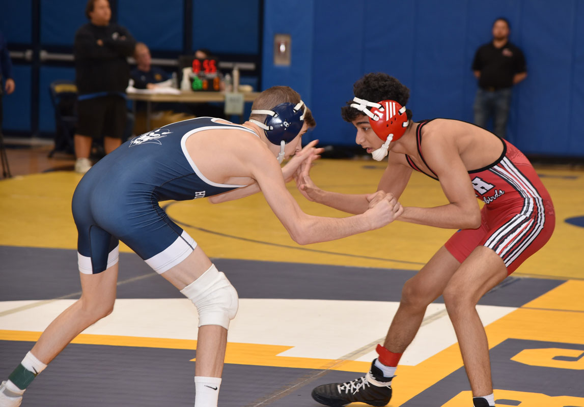 Joe Petrone (left) sets up an opponent for a takdown.