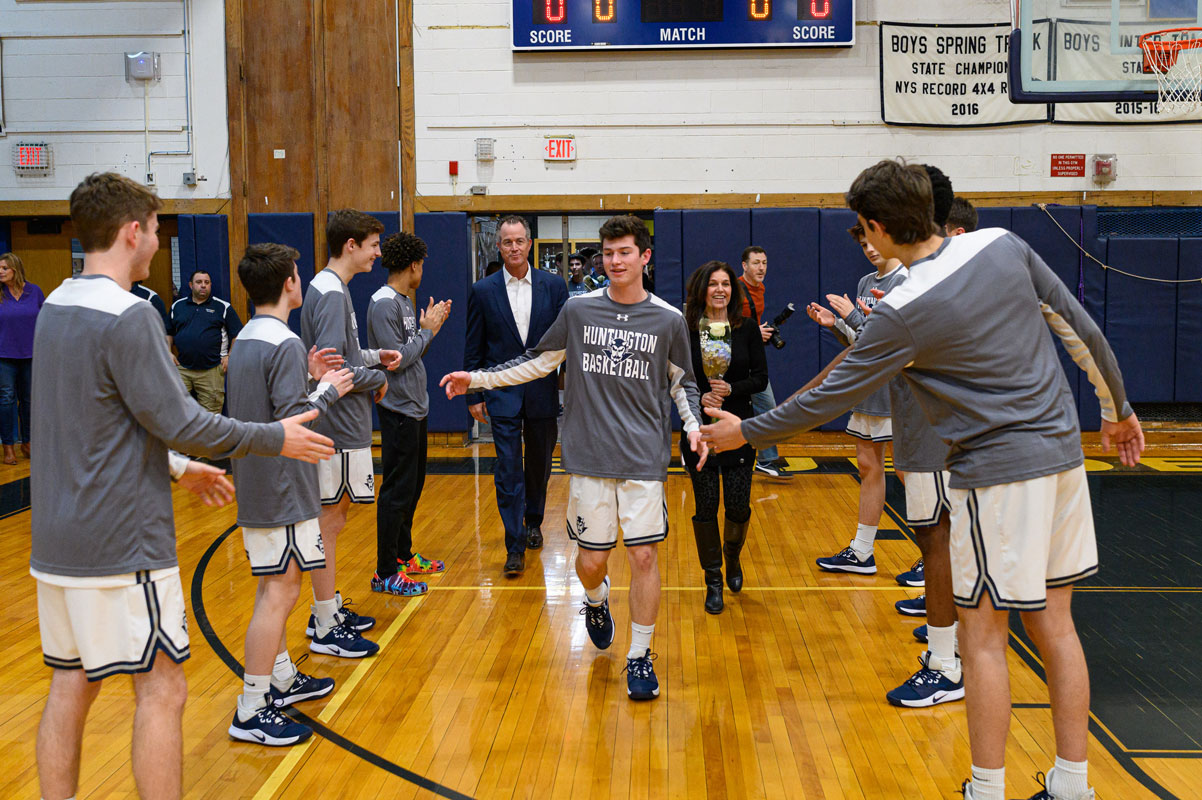 Jack Monahan enters the gym on Blue Devil basketball Senior Night. (Darin Reed photo.)
