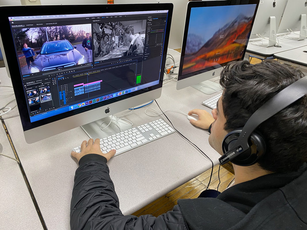 Christopher Bavaro at work editing a film project at Huntington High School.