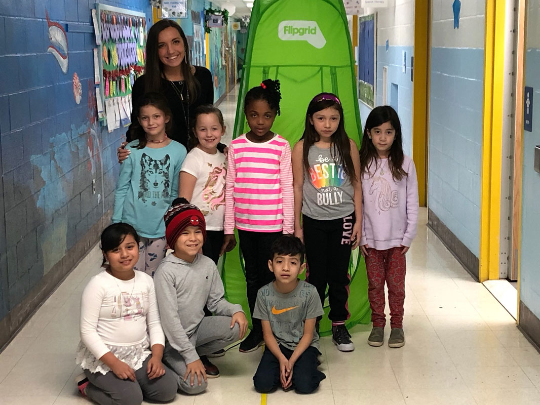 Southdown teacher Valerie Murray with a group of students in front of a Flipgrid tent.