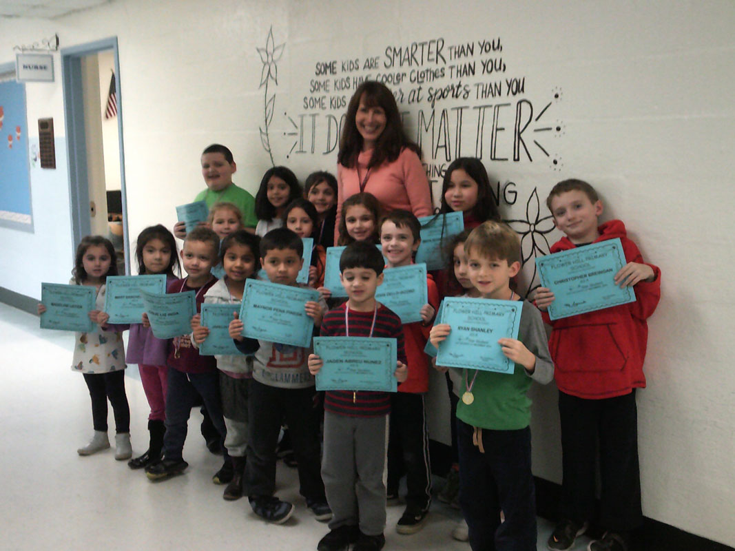 Principal Lucia Laguarda with Flower Hill's Star Student Award recipients.
