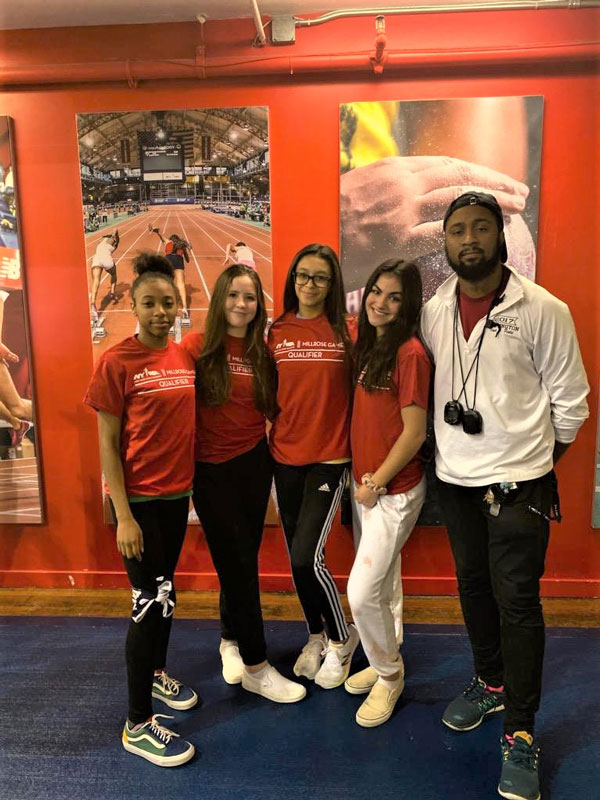 Huntington relay stars Alicia Brooks, Caroline O’Rourke, Analisse Batista and Brianna Halbeisen with Blue Devil head coach Mark Jackson.