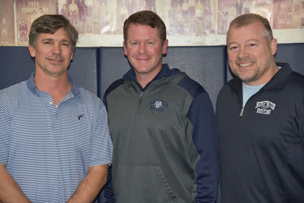 Huntington head coach Travis Smith (center) with assistants Mike Marinello and Jamie St. John.