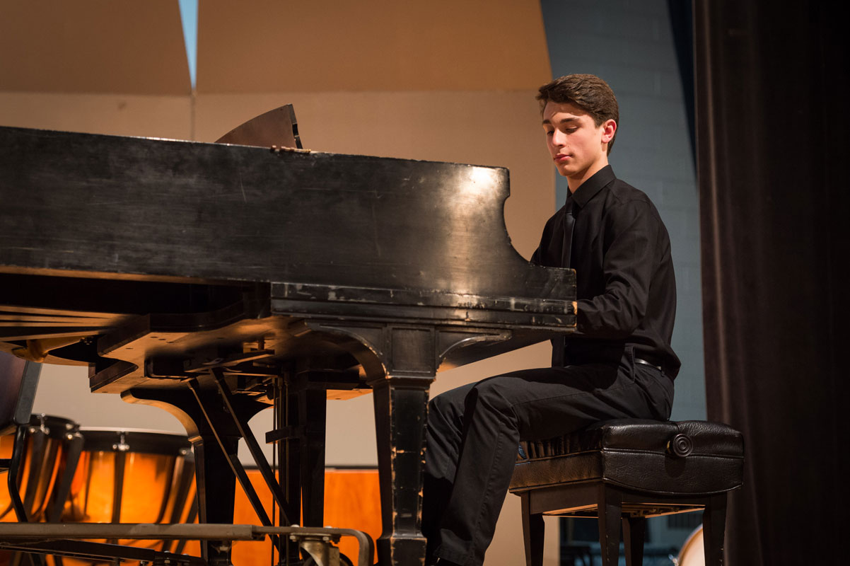 Julien Rentsch on the Huntington High School stage. (Darin Reed photo)