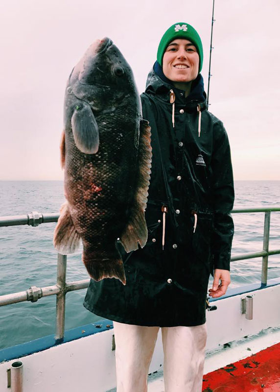 Alyssa Salese loves to fish. Here she holds a huge blackfish that she caught.