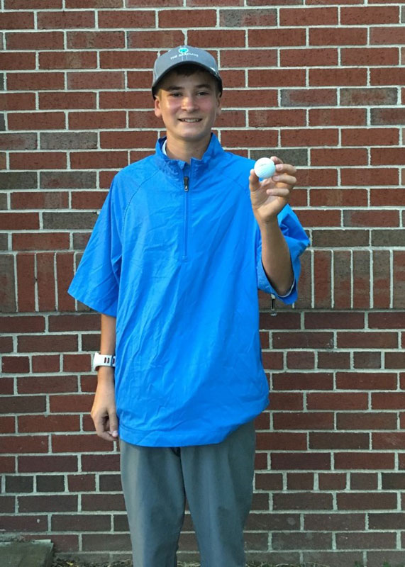 Pat Sclafani as a Huntington freshman holding the ball he sunk for a hole in one 
