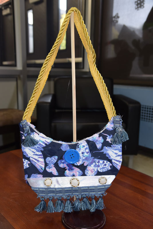 Colorful handbags created by Washington School third graders are on display now 