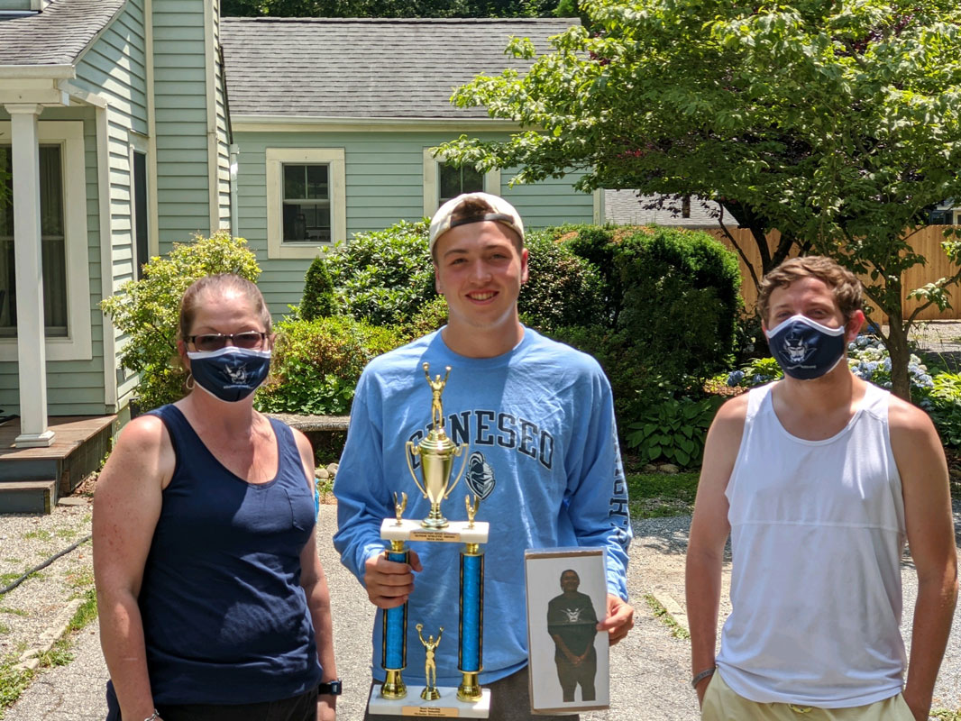 Blue Devil boys' fencing senior MVP Nicholas Kretschmer with coaches Michelle O'Brien and Burke Tomaselli.