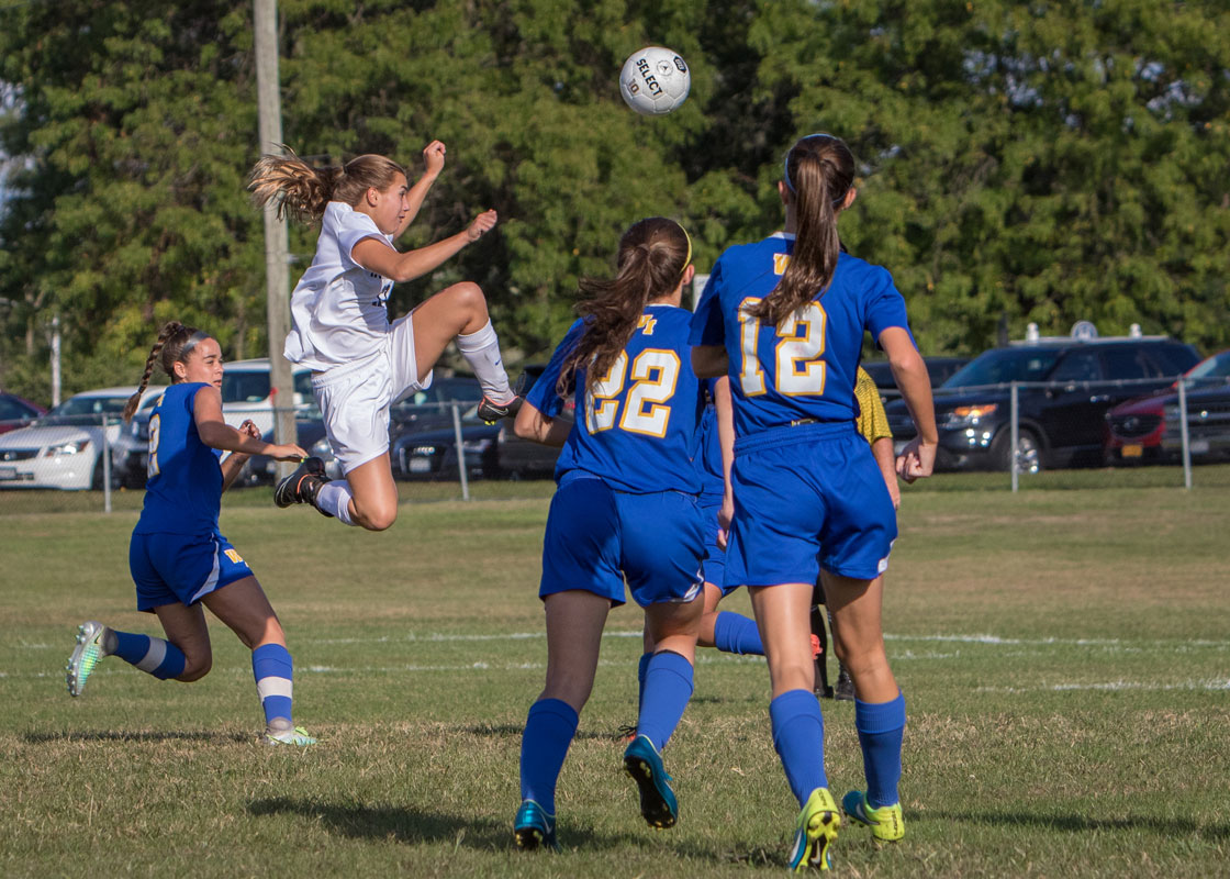 Marissa Stafford  goes airborne for the ball. (Mike Connell photo.)