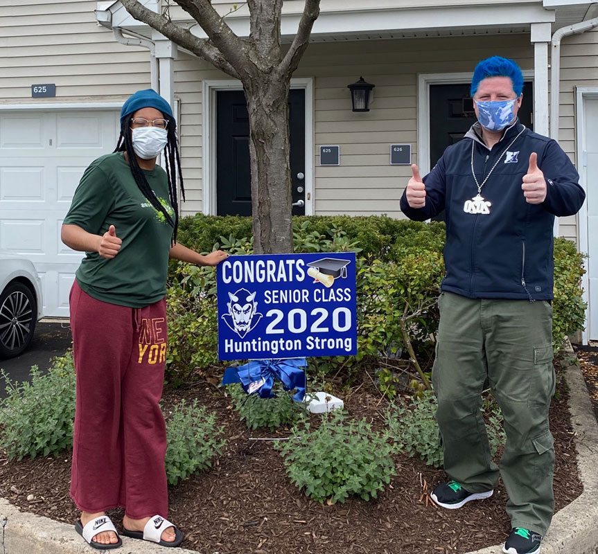 Mya Davis outside her home with Huntington Principal Brenden Cusack.