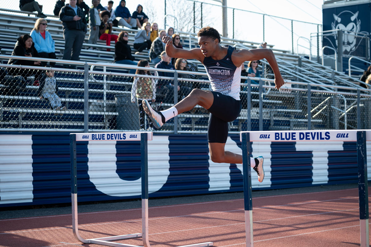 Rahliek Thomason-Jackson clear a hurdle for Huntington. (Darin Reed photo.)