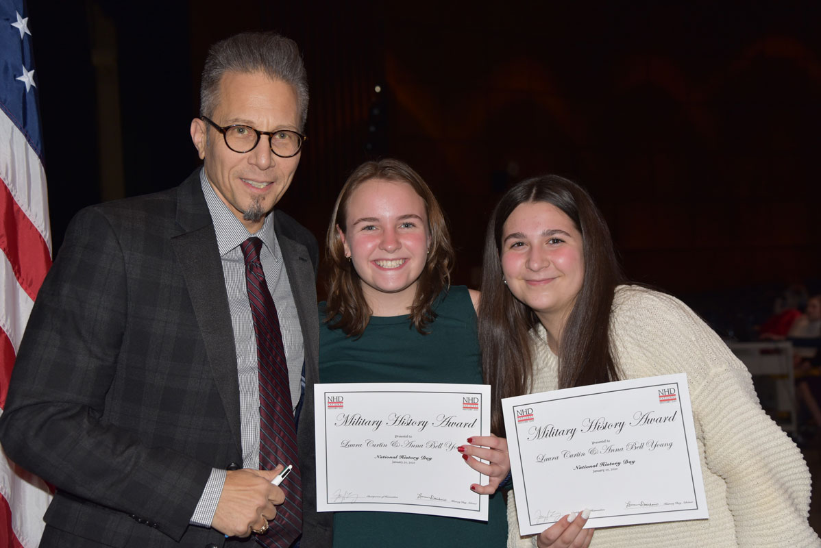 Teacher Peter Crugnale with award recipients Anna Bell Young and Laura Curtin 
