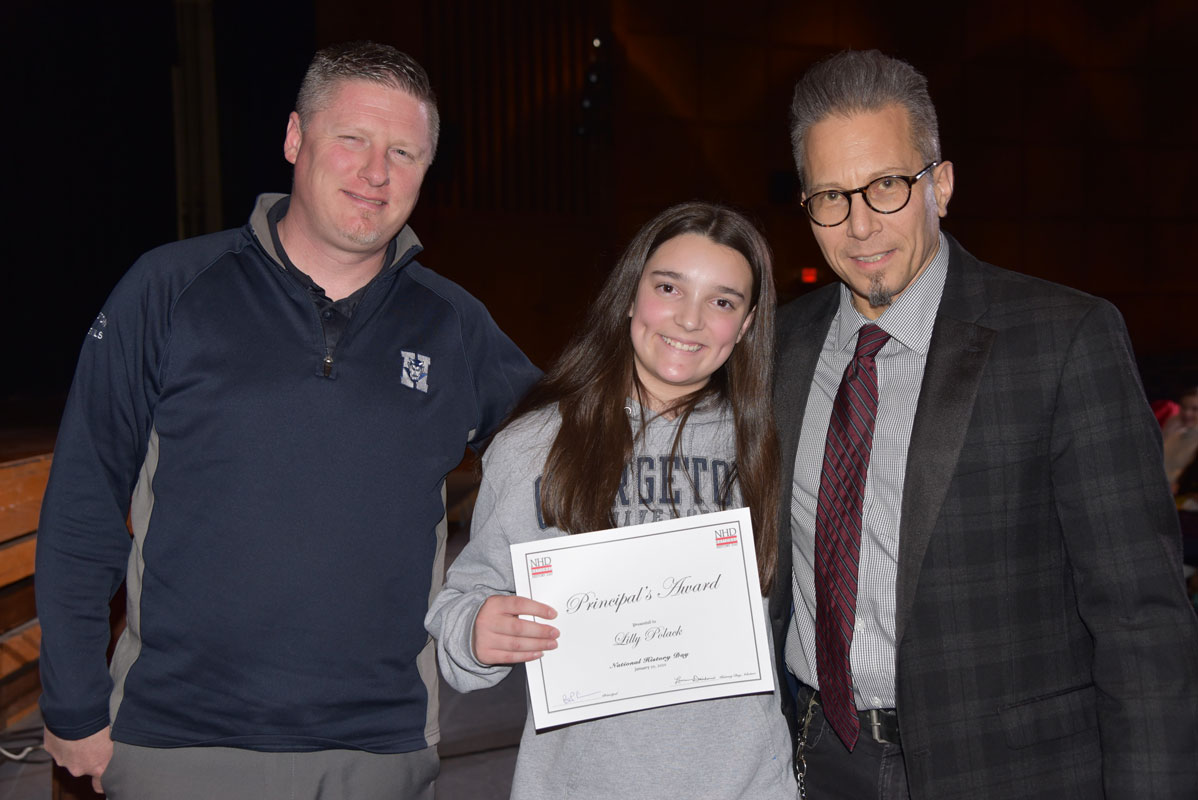Principal's Award recipient Lilly Polak with Principal Brenden Cusack and teacher Peter Crugnale.