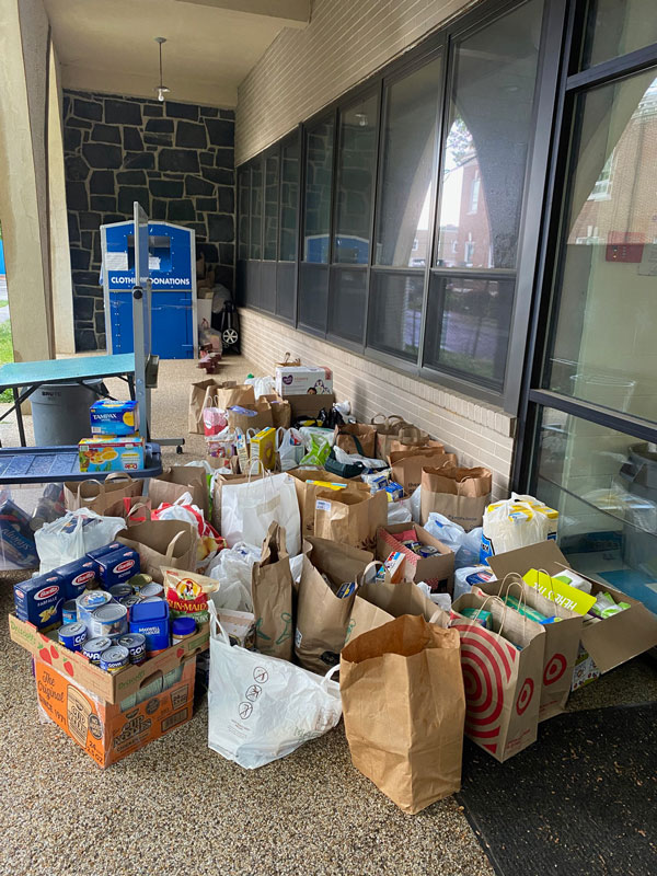 The two dynamic Huntington seniors helped replenish the barren shelves of local food pantries.