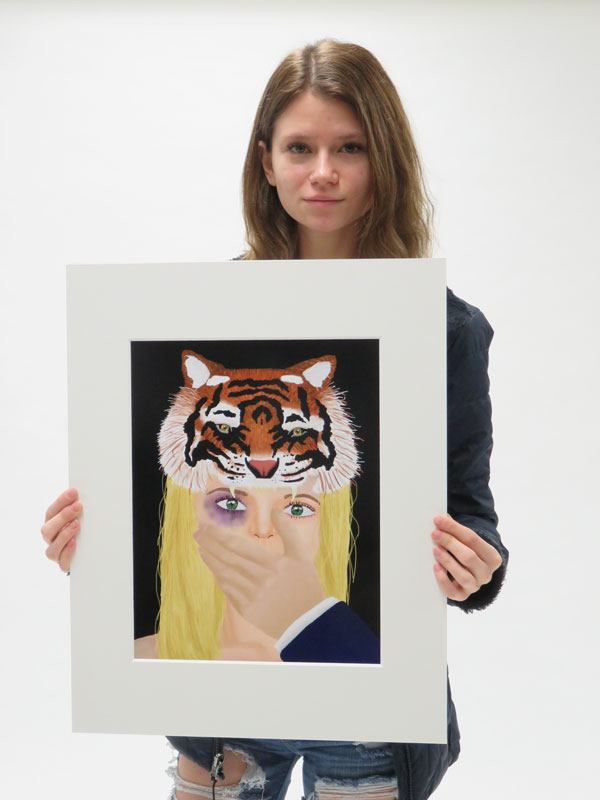  Christina Hornstein holding her artwork.