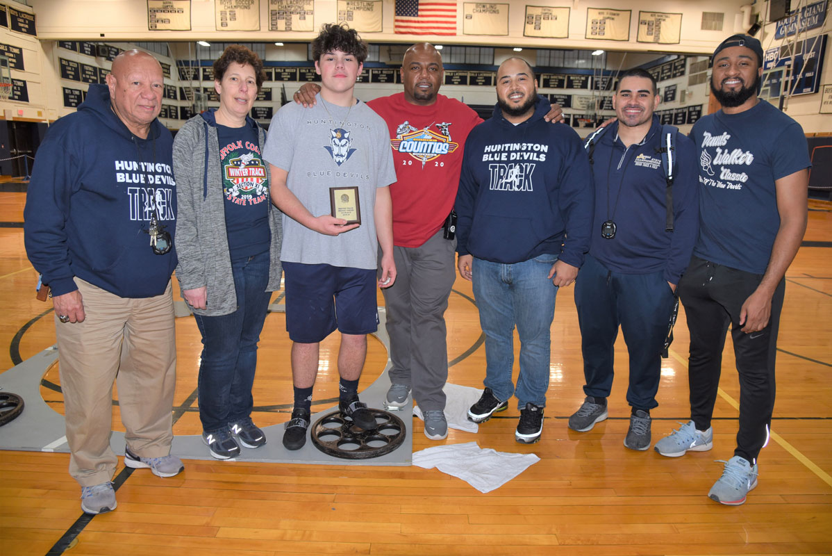 Huntington senior Gary Barash (shown with Blue Devil coaching staff members) qualified for the state weight throw championship.