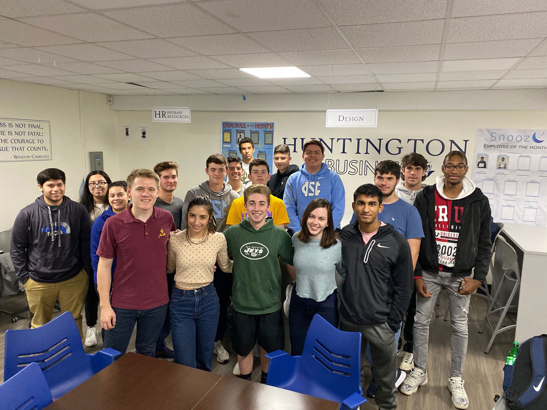 The Titan company team is shown in the Virtual Enterprise classroom at Huntington High School.