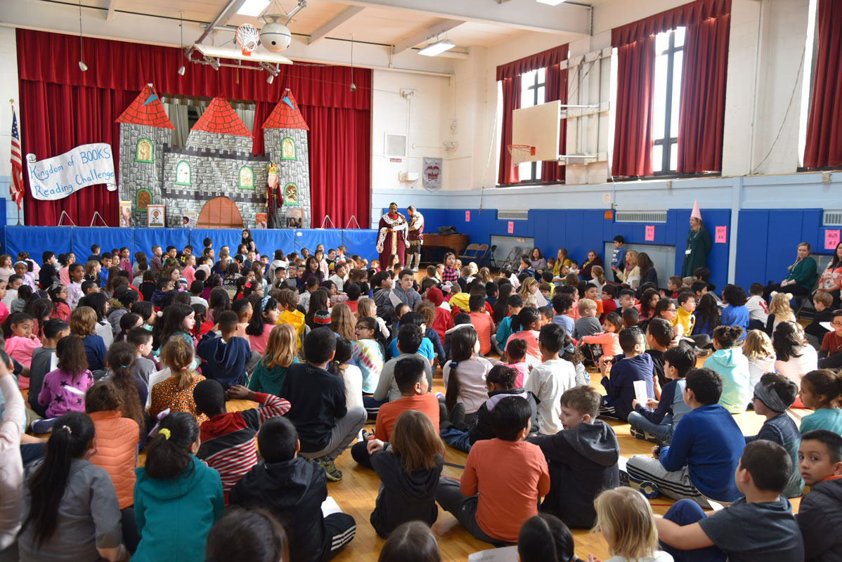 The Washington School gym was packed for the kickoff to the reading program