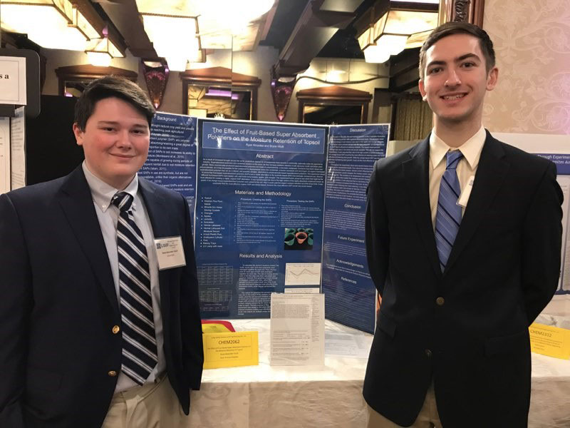 Huntington seniors Bryce Vitulli and Ryan Knowles at the LI Science and Engineering Fair at Woodbury.