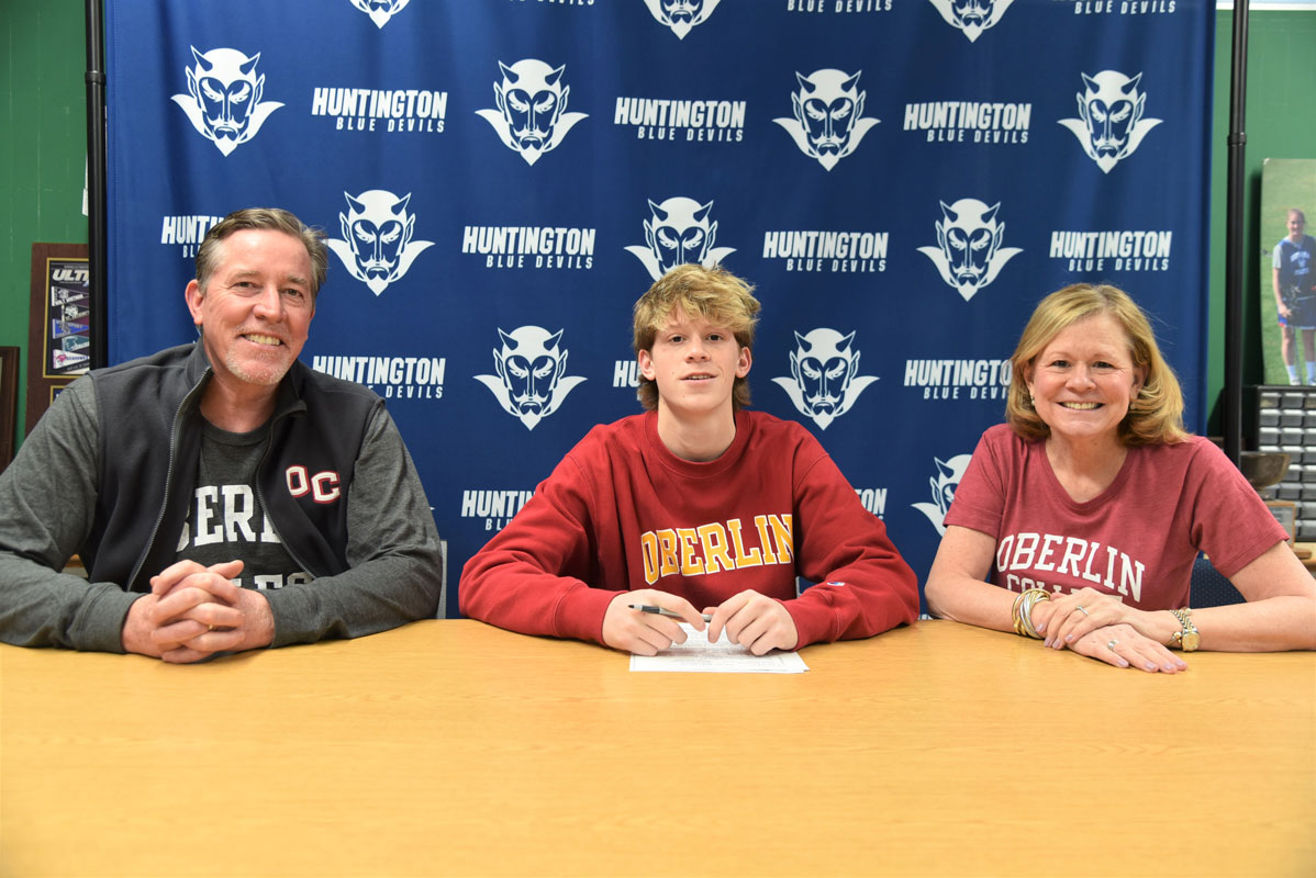 Huntington senior Cole Pillion with his parents, Tim and Jean. He has committed to play lacrosse at Oberlin College 