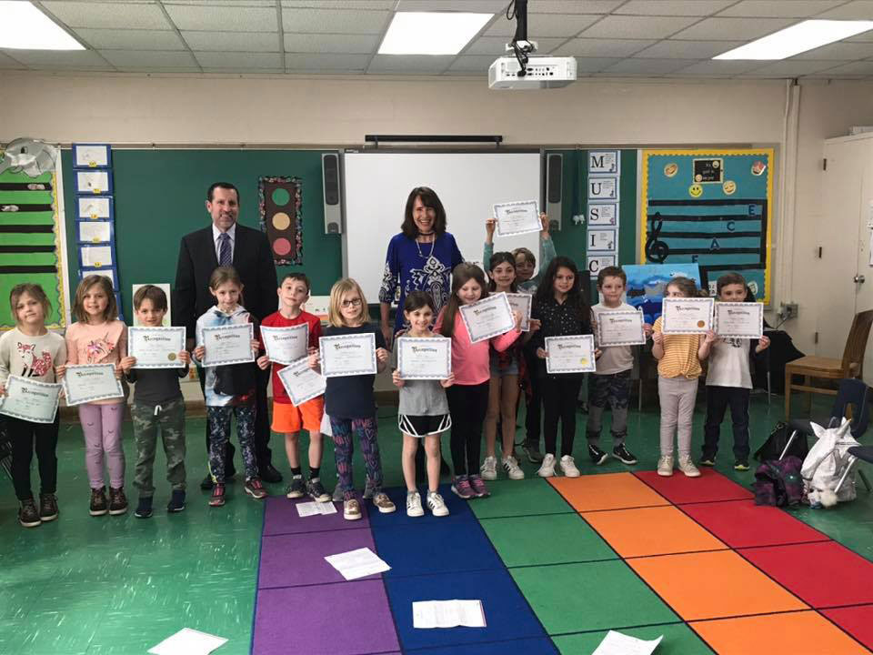 Superintendent Jim Polansky and Flower Hill Principal Lucia Laguarda with PTA Reflections program participants.