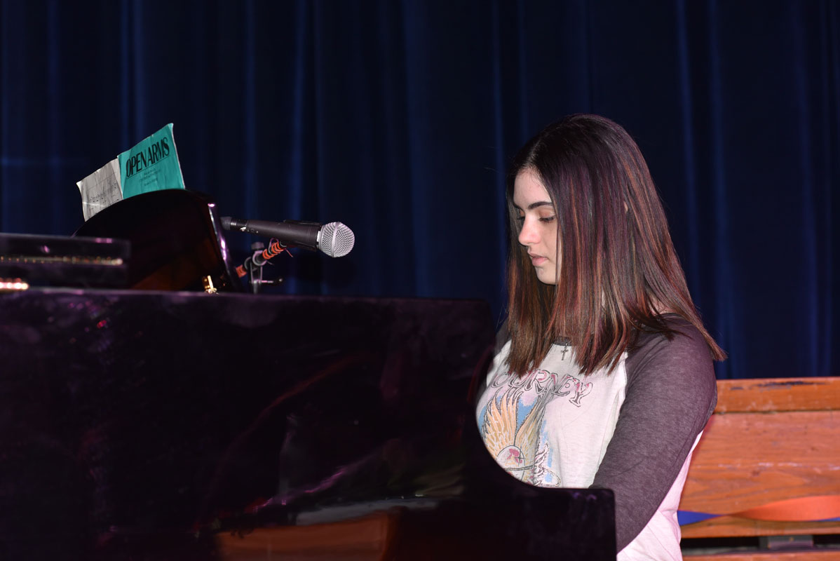 Huntington freshman Isabella Lanfranco won first place honors for her piano and vocal performance of Journey's Open Arms.