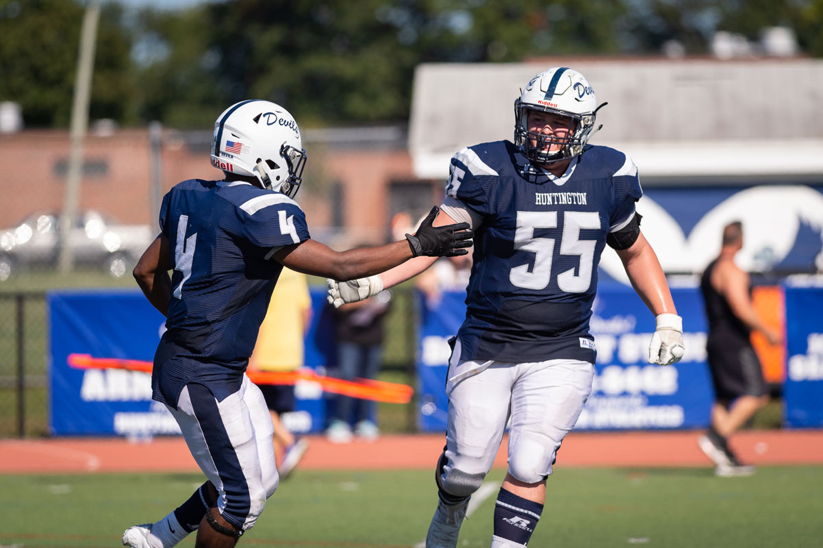 Aidan Mrotzek (right) is happy following another Huntington touchdown. (Darin Reed photo.)