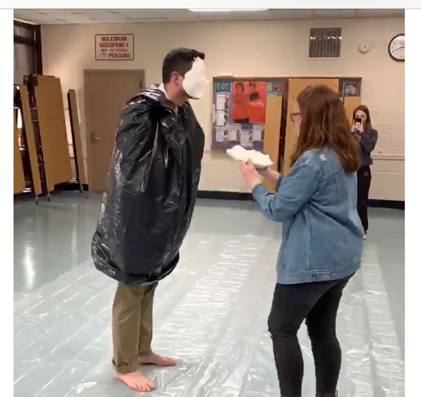 Math teacher David Moriarty took a pie in the face to raise scholarship funds.