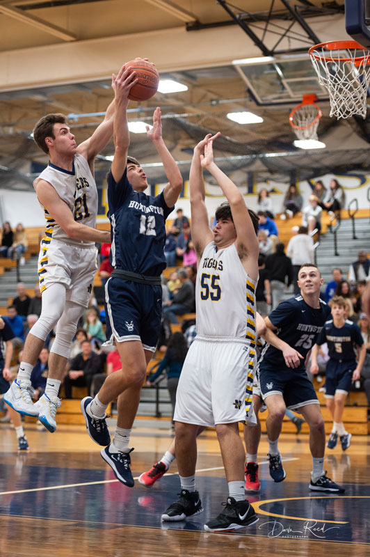 Max Rentsch gets double-teammed by Northport. (Darin Reed photo.)
