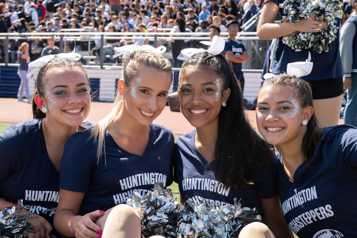 Bella Thompson (right) with fellow Huntington Highsteppers. (Darin Reed photo.)