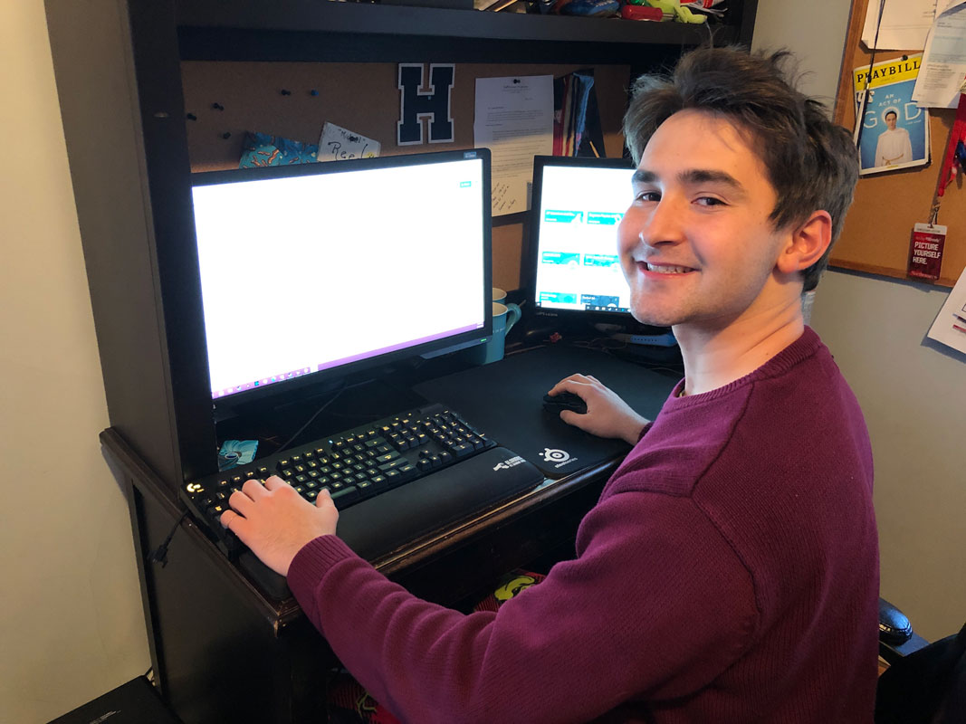 Senior Michael Reed requires not one but two computer screens to complete all of his work. (Darin Reed photo.)