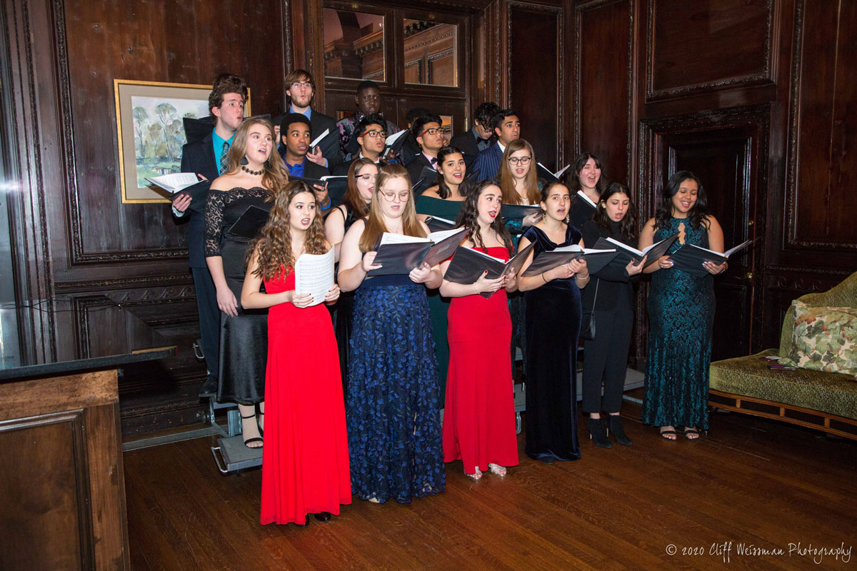 Huntington High School chamber choir members performed a selection of songs as guests arrived. (Cliff Weissman photo.)