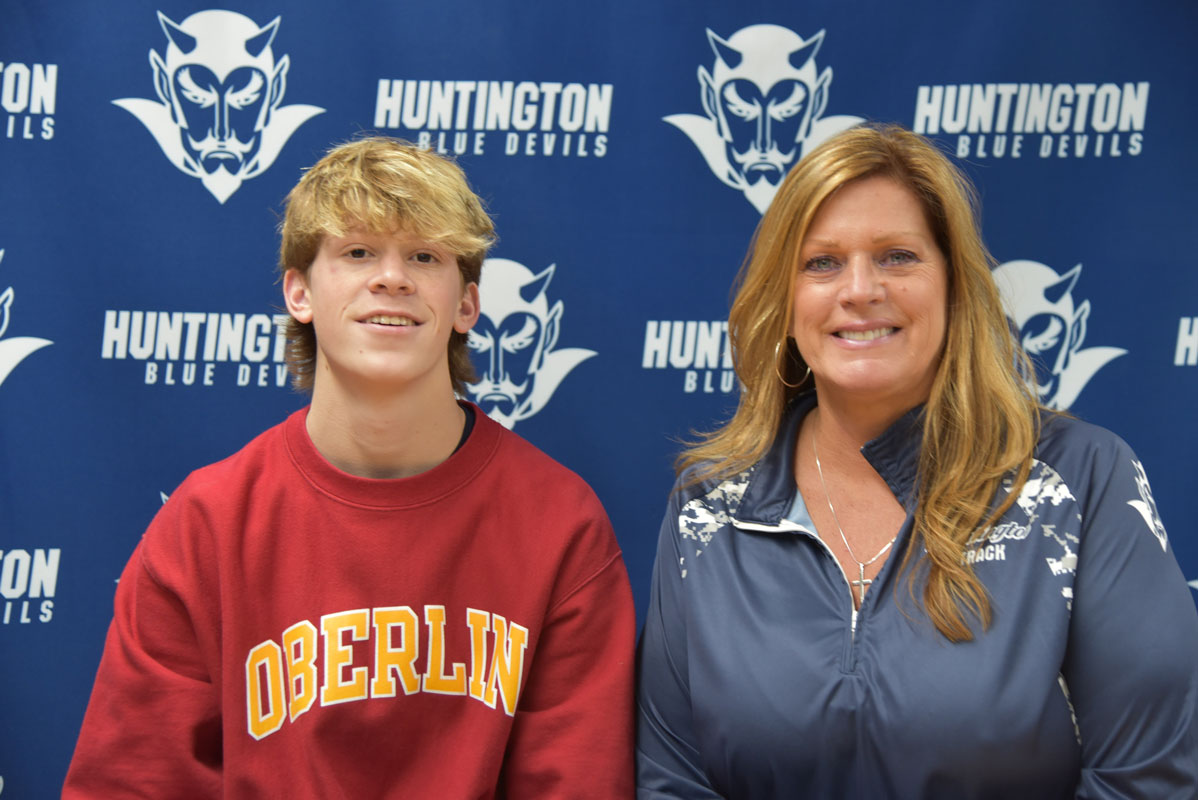 Huntington senior Cole Pillion with Director of Athletics Georgia D. McCarthy 