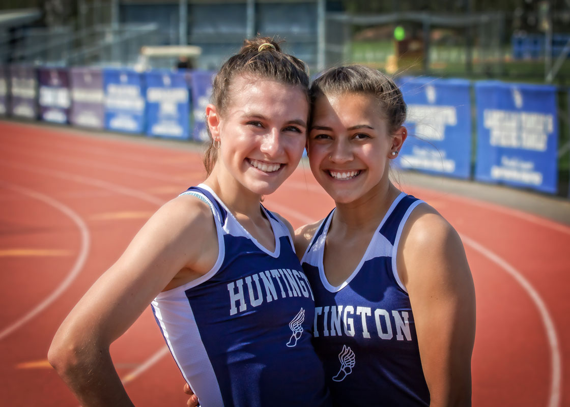 Bella Thompson (right) and Alexandra McKenzie on the Blue Devil Stadium track. (Mike Connell photo.)