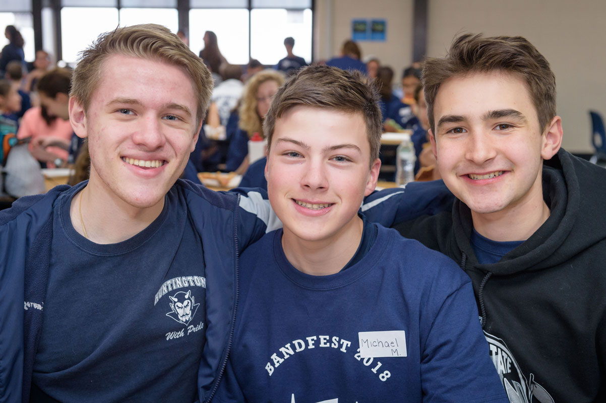Michael Mathews is flanked by Chris Mavrogian and Michael Reed at Band Fest. (Darin Reed photo.)