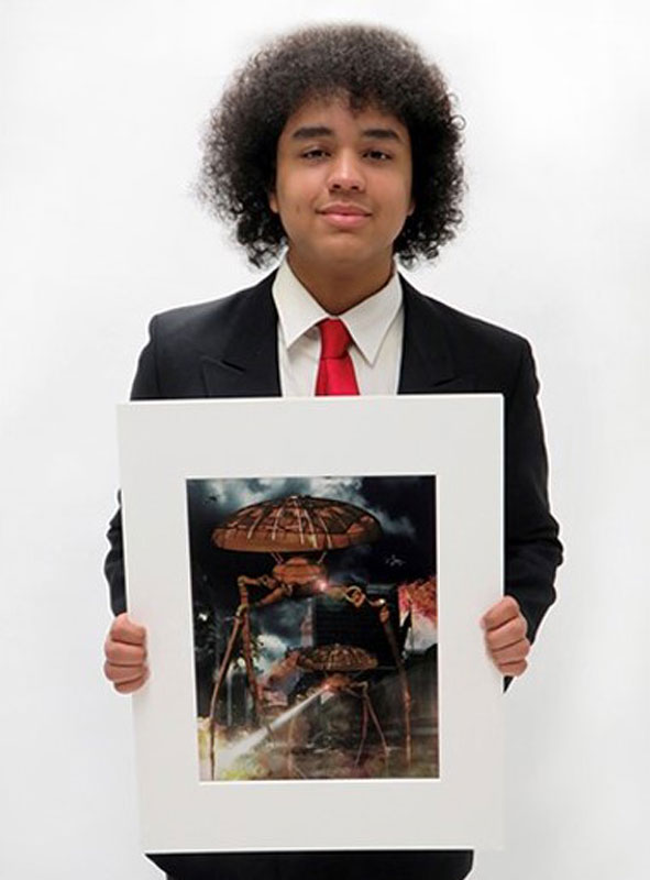 Abraham Rodriguez holds his highly regarded artwork that's on exhibit at the Heckscher Museum.